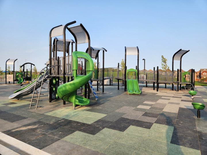 Modern playground structure in a sunny community park in Cornell, Markham.