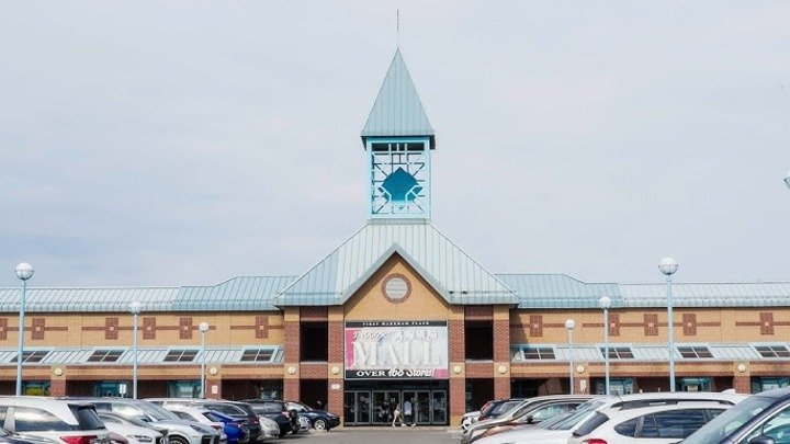 Clocktower and storefronts at a shopping plaza near Cornell, Markham.
