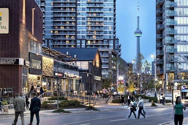 Outdoor shopping area near Mill Pond, Richmond Hill featuring retail stores, restaurants, and a pedestrian-friendly layout.